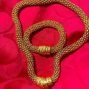 Gold tone heavy necklace with bracelet.Magnetic closure., lion Pierced earrings